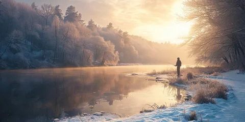 Foto op Canvas A person standing on a snow covered shore next to a body of water. Suitable for winter landscapes and outdoor activities © Fotograf