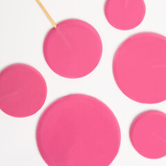 Round pink lollipops on a white background. Sweets banner. Children's snack.