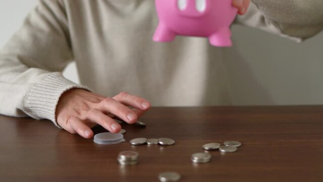 Person accessing savings. Concept of needing money and spending reserve money. Little savings.
