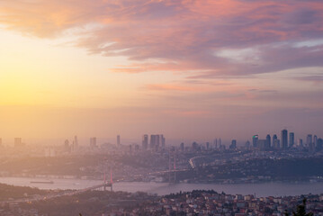 Istanbul Bosphorus Bridge at sunset and evening lights with colorful clouds in the sky