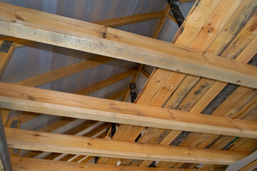 close-up - roof construction, wooden boards and beams