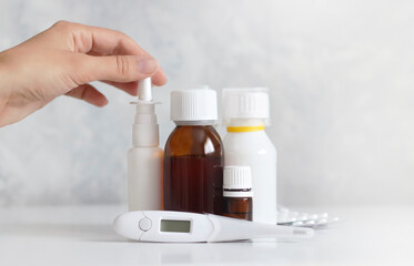 Online pharmacy order and medications delivery. Health and medical. woman's hand takes a spray for a runny nose