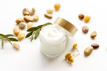 Fototapeta na wymiar Skincare moisturizer face cosmetic cream. Glass vial of cosmetic face skin care cream