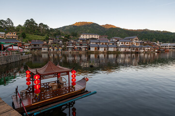 Chinese style rowing boat in the lake at Rakthai village, Mae Hong Son, Thailand