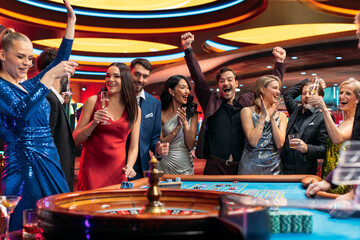 Group of Diverse Young People Gambling at a Casino. Beautiful Female and Handsome Male Guests...