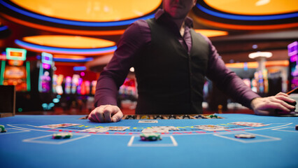 Online Casino: Professional Croupier Deals Cards on Blackjack Table. Anonymous Dealer Masterfully Revealing Jackpot Possibly Winning Hand, Excitement in High-Stakes Game for Payout. Close-Up Shot - obrazy, fototapety, plakaty