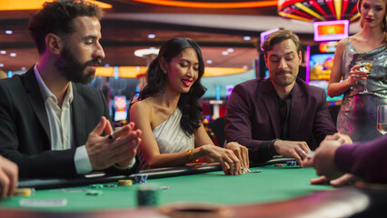 Diverse Group of People Playing Poker in a Luxurious Casino Championship. Private Club Guests Feeling Lucky, Placing Bets, Reading Opponents, Counting dealed cards, Calling Out Each Other for Bluffing - obrazy, fototapety, plakaty