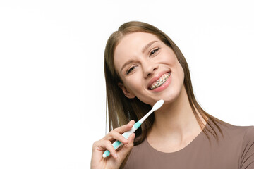 Young beautiful woman with toothbrush isolated on white background