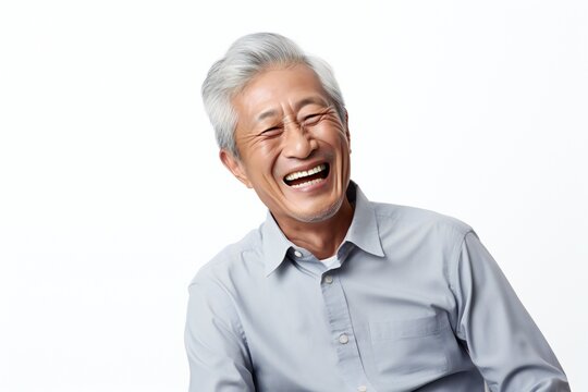 professional portrait studio photo of a handsome old asian american tatooed man model with perfect clean teeth laughing and smiling. isolated on white background. for ads and web design
