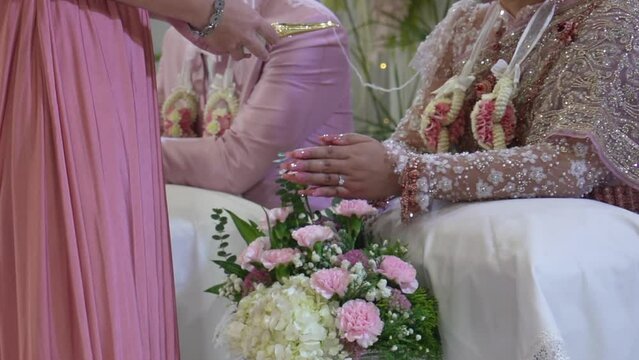 slow motion shot watering and pray to grrom and bridal on wedding ceremony