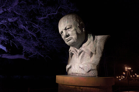 Blenheim Palace, Woodstock, Britain - 12.30.2023: The mysterious statue of Winston Churchill in the night evokes a sense of mystery. Ideal for mystery, history and art concepts