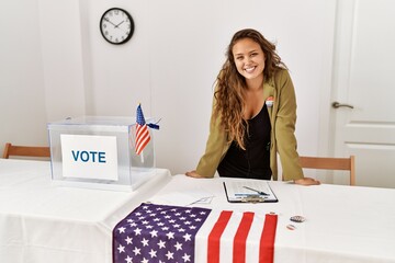 Young beautiful hispanic woman electoral table president smiling confident at electoral college