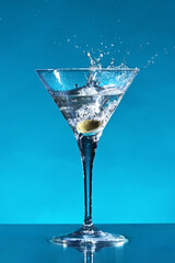 Cocktail with splashing olive