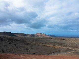 Spectacular views of the Fire Mountains at Timanfaya National Park, this unique area consisting entirely of volcanic soils. A Mars-like volcanic landscape in a sea of ​​lava. Lanzarote, Canary Island