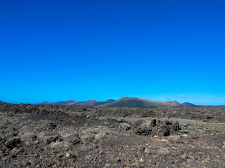 Spectacular views of the Fire Mountains at Timanfaya National Park, this unique area consisting entirely of volcanic soils. A Mars-like volcanic landscape in a sea of ​​lava. Lanzarote, Canary Island