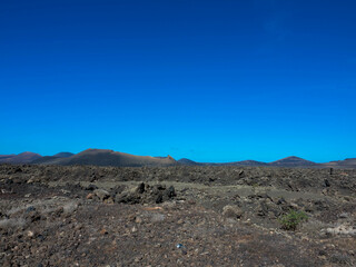 Spectacular views of the Fire Mountains at Timanfaya National Park, this unique area consisting entirely of volcanic soils. A Mars-like volcanic landscape in a sea of ​​lava. Lanzarote, Canary Island
