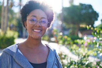 African american woman smiling confident standing at park