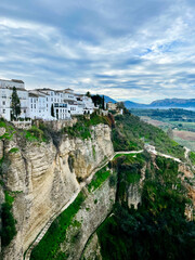 Fototapeta na wymiar White houses on the cliff near Puente Nuevo Bridge in Ronda, Spain