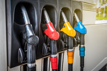 Gun gas pistol petrol station of different colors. Industrial theme