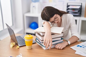 Young caucasian woman business worker sleeping at office