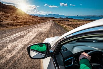 Traveling by car on the majestic landscapes in Iceland. Rear mirror view - obrazy, fototapety, plakaty