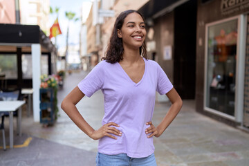 Young african american woman smiling confident looking to the side at coffee shop terrace