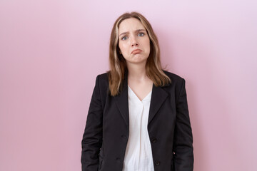 Young caucasian business woman wearing black jacket depressed and worry for distress, crying angry...
