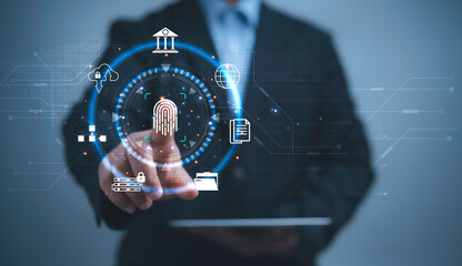 Businessman using thumb to scan finger print or for digital processing biometric identification to access security system includes internet banking.Technology Cyber security concept.