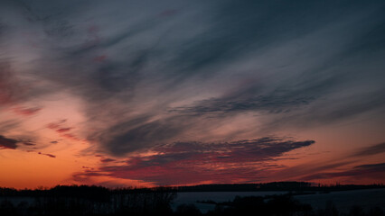 sunset in the sky. sunset over the hills