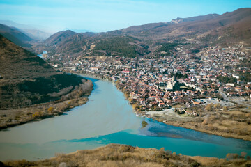 View of the city of Mtskheta from the Jvari Monastery. Confluence of the Aragvi and Kura rivers. Mtskheta, Georgia, December 2023