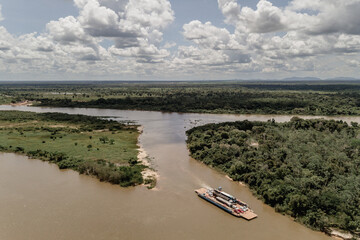 drone view of a boat on the river