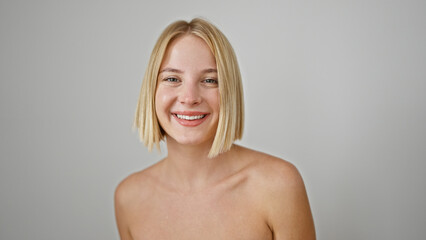 Young blonde woman smiling confident standing over isolated white background