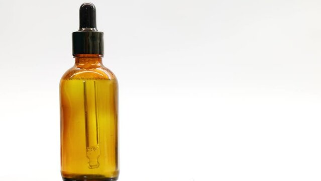 Vial of cheesecloth rotates a white background