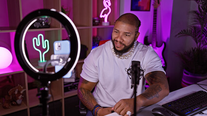 African american man with beard in gaming room at night