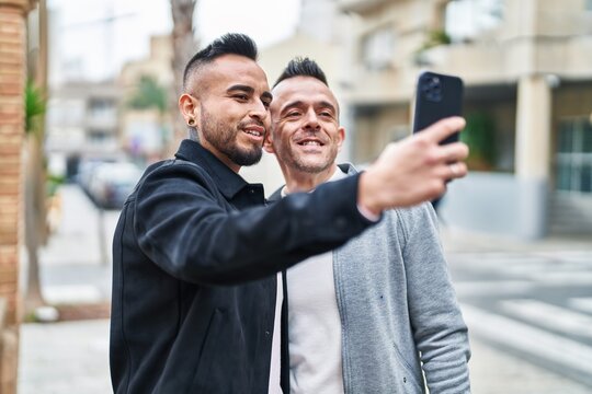 Two men couple smiling confident make selfie by smartphone at street