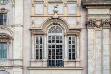 A beautiful window from the magnificent front facade of the Church of Sant'Agnese in Agone in Piazza Navona, Rome, Italy