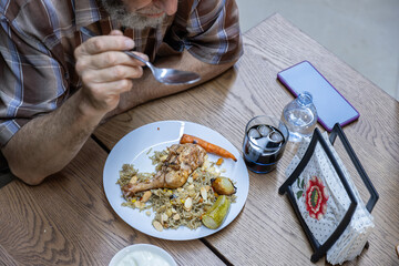 multi generation family eating together with grandfather
