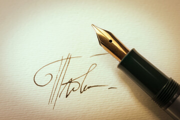 Fototapeta premium Sheet of paper with fountain pen and signature, top view