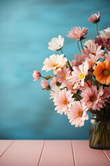 Bouquet of pink and white chrysanthemums in a glass vase.