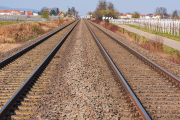 Fototapeta na wymiar Parallel train tracks in a track bed