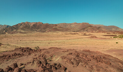 Gravel roads meander through a rocky area on the edge of the Namib desert in the Erongo district of...