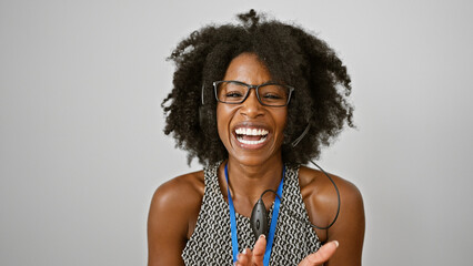 African american woman business worker wearing headset smiling over isolated white background