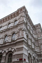 A tall old building in Prague city on a cold freezing winter day
