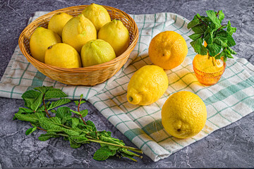Still Life of Lemons and Peppermint in Dark Marble