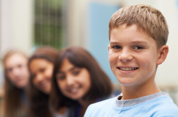 Boy, portrait and happy outdoor at school with confidence and pride for learning, education or...