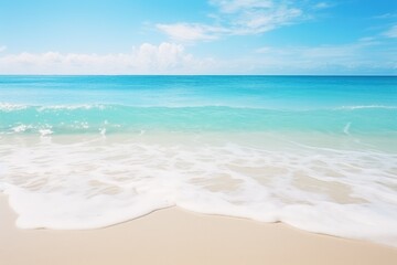 Fototapeta na wymiar Sandy Beach With Blue Ocean in Background
