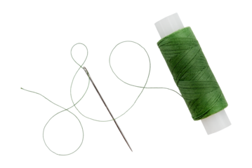 Old spool of thread and needle on a white background. Sewing accessories