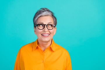 Portrait photo of optimistic old woman looking empty space cheerful smile likes buy new eyeglasses...