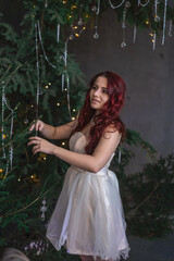 girl in white in the Christmas studio