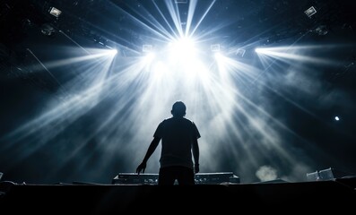 Man Standing in Front of Stage With Bright Lights - obrazy, fototapety, plakaty